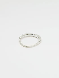 A fine silver ring with a carved, irregular design, displayed on a plain white background.