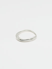 A fine silver ring with a carved, irregular design, displayed on a plain white background.