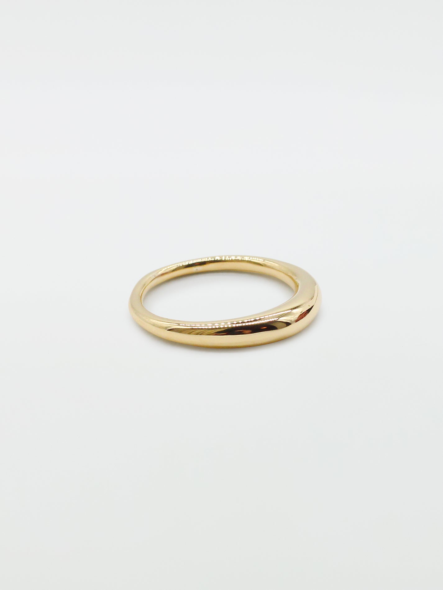 Side view of a bulbous gold ring