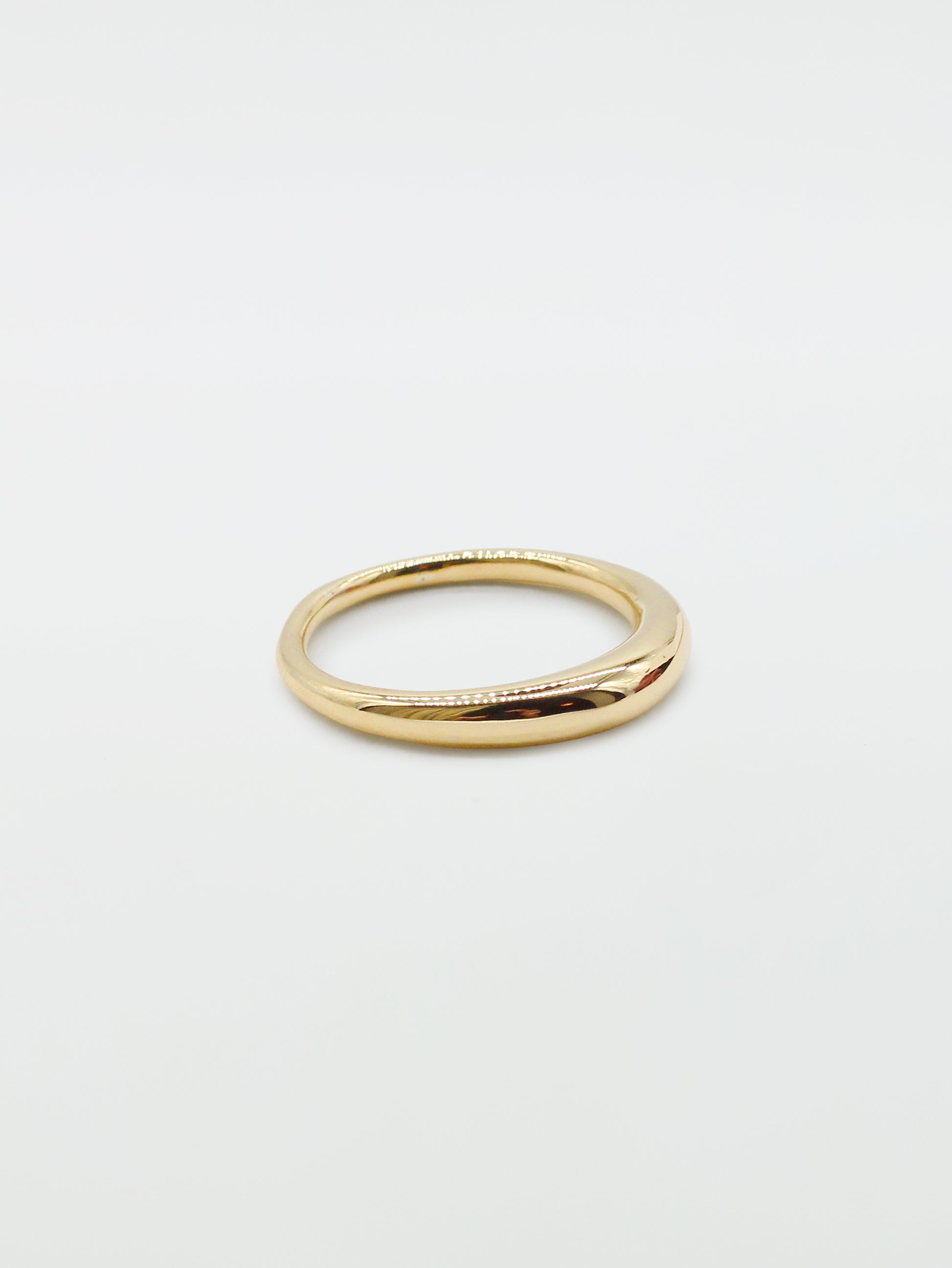 Side view of a bulbous gold ring