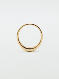 A simple band ring with a glossy finish, likely made of gold, shown on a white background.
