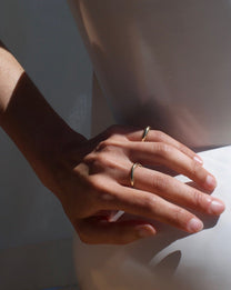 Close up of two gold rings on hand